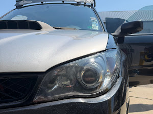 The same silver wagon with clear restored headlights